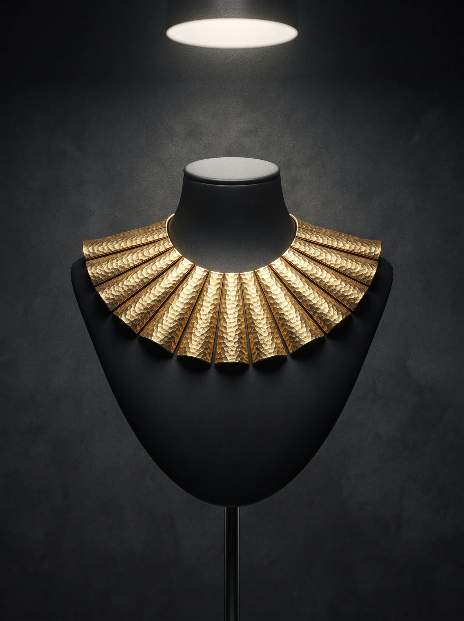 The Sun Collar on a black bust: a rigid collar of hammered gold plates that spread like rays